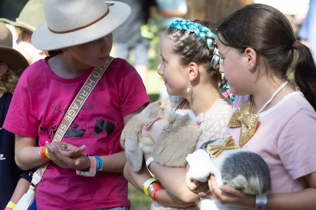 Girls showing off their guinea pigs