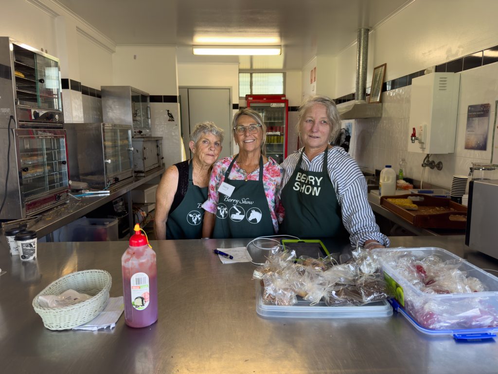 Three volunteers in the kitchen