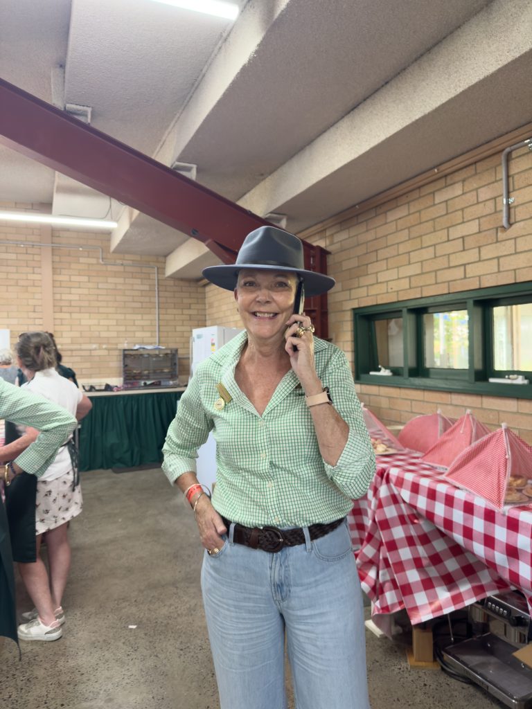 A volunteer on the phone in the hall