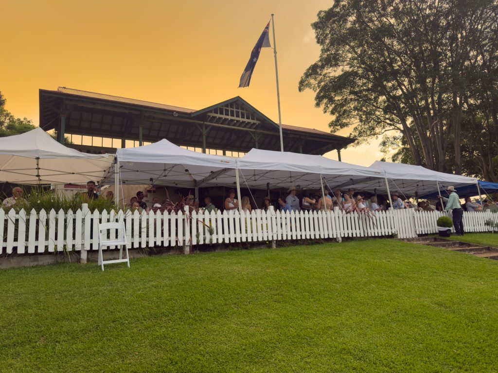 The grandstand and marquees at sunset