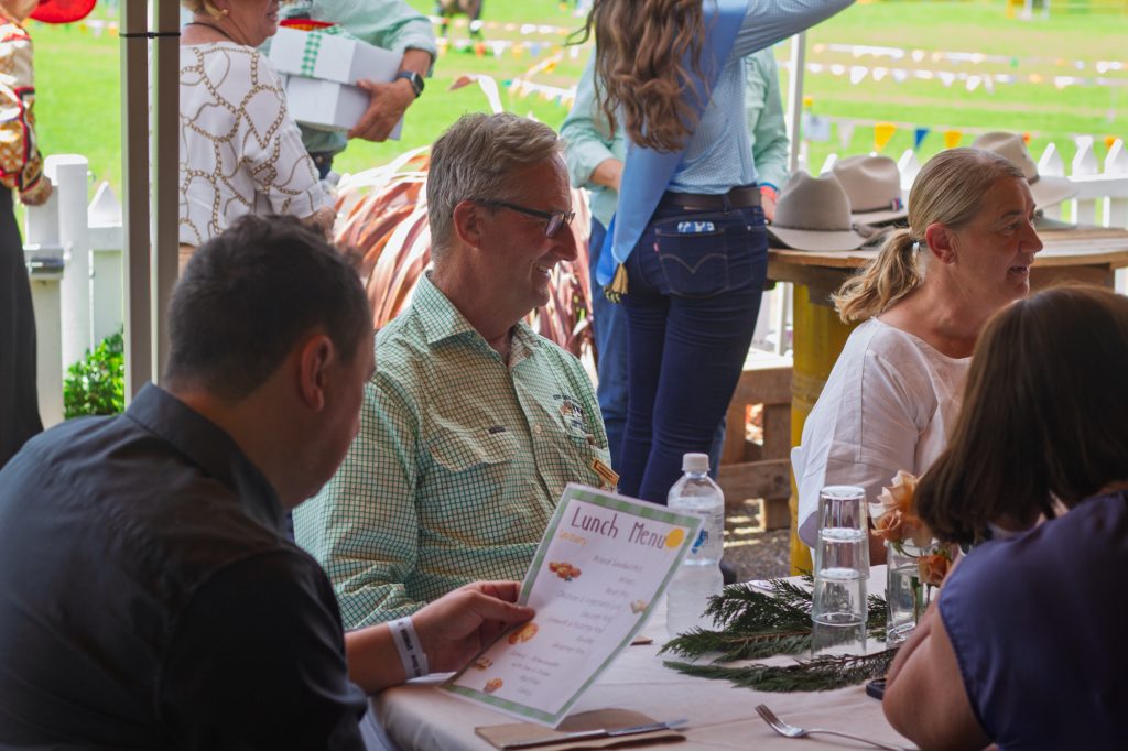 Guests at lunch under the marquee