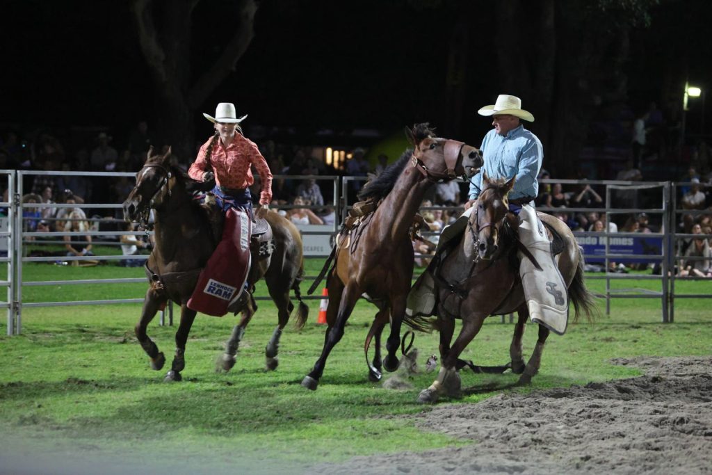 Pick-up riders galloping across the arena