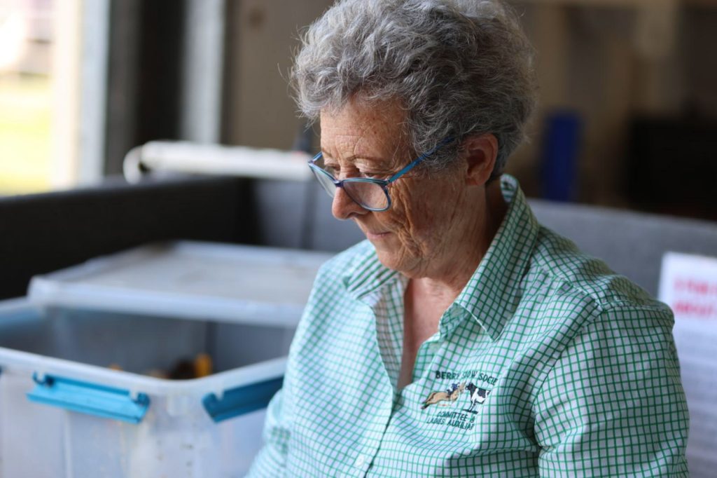 A volunteer sorting supplies