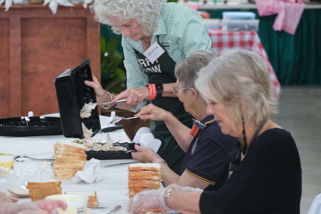 Volunteers serving at the café counter