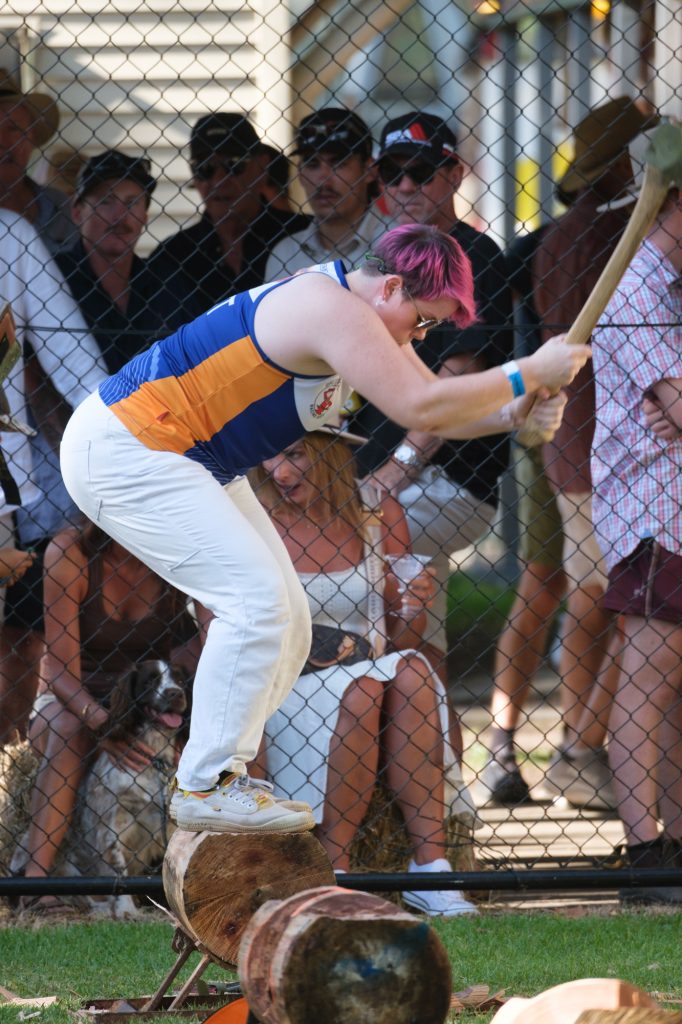 An axeman mid-swing in the underhand chop