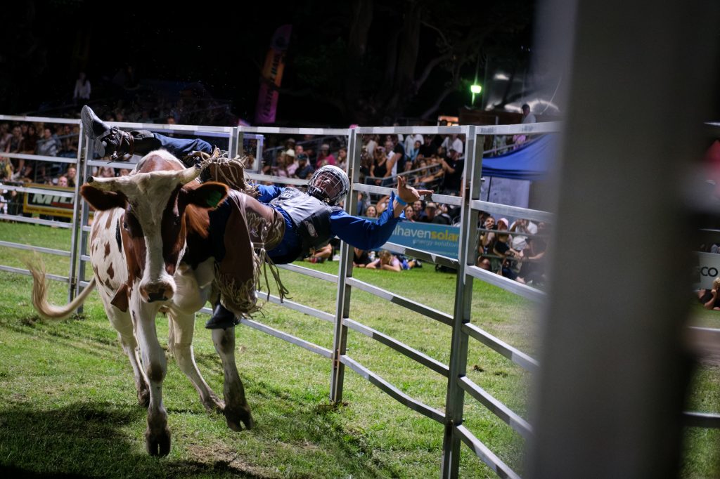 A rider thrown against the fence