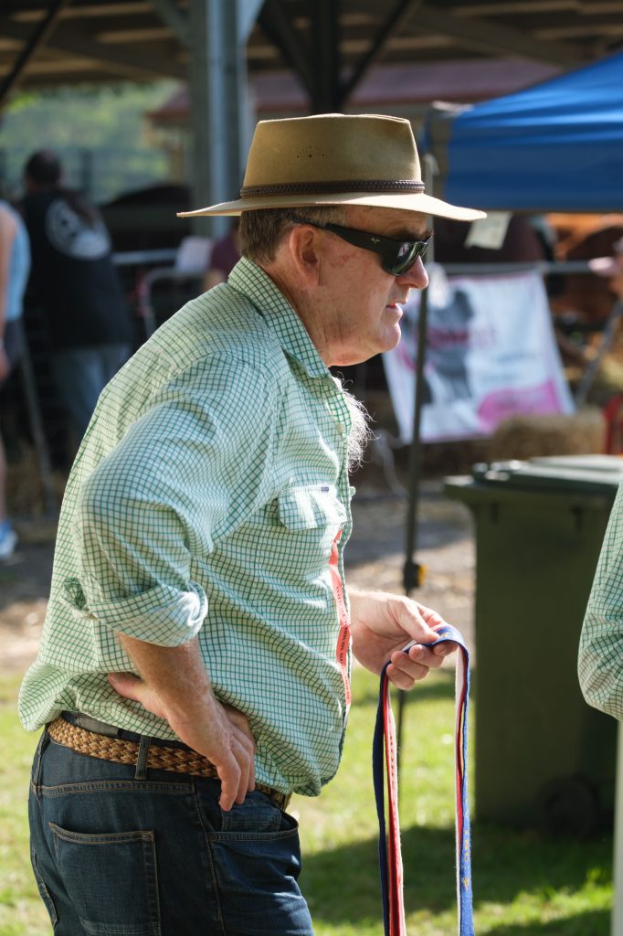 A man in an Akubra beside the ring