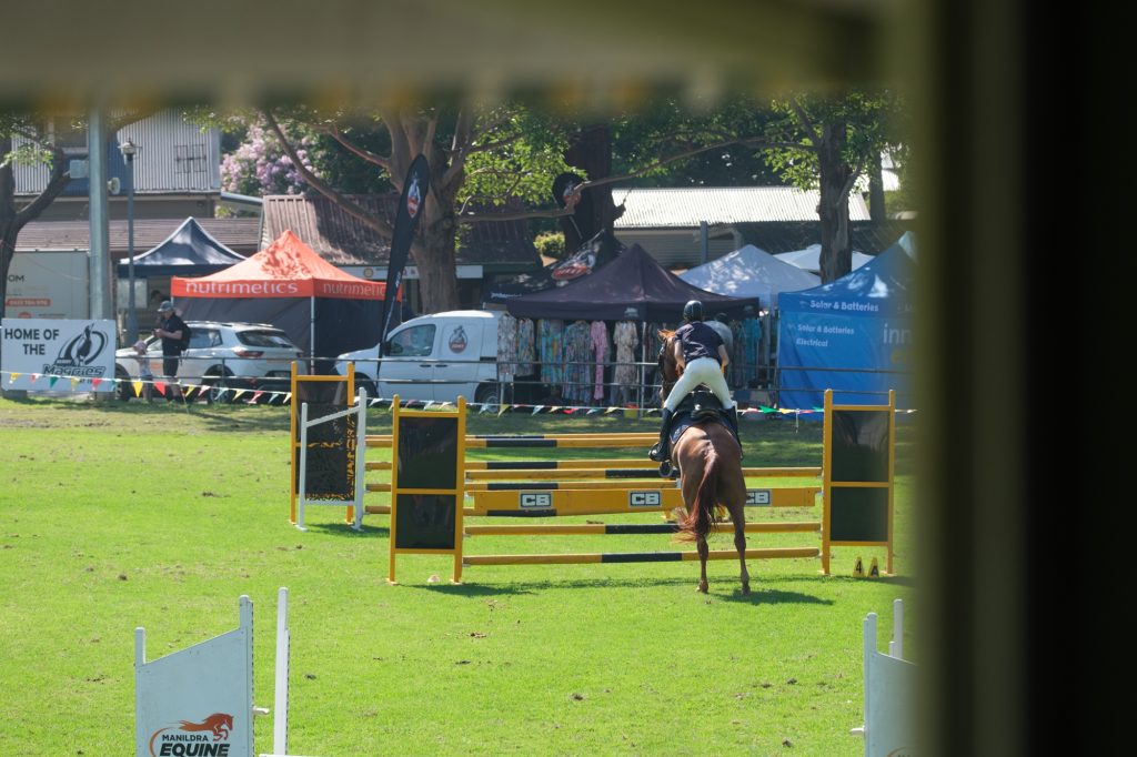A rider on course in the showjumping ring