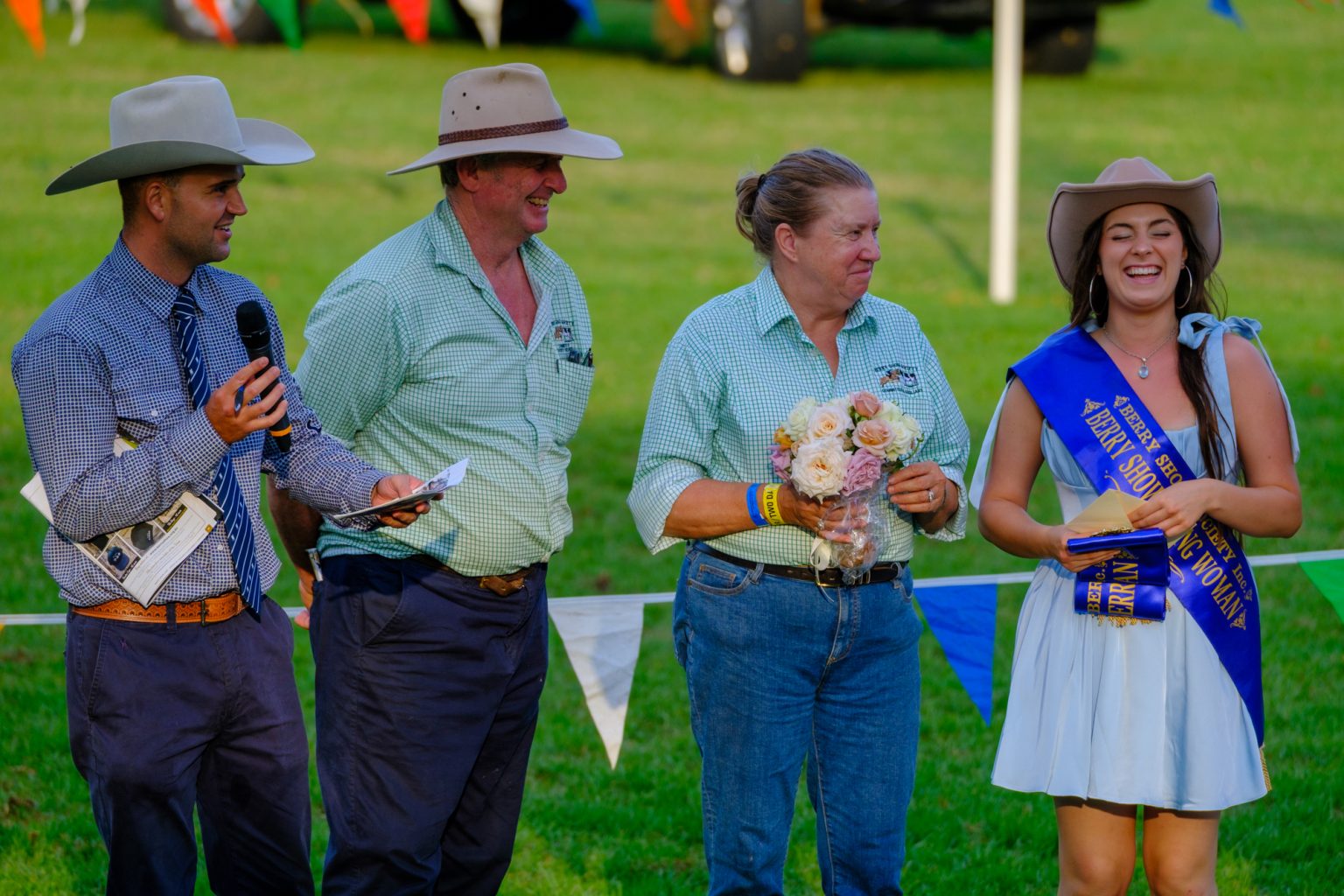Society members and the Berry Show Young Woman in her sash during a presentation in the ring